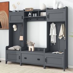 a room with a large gray shelf and mirror