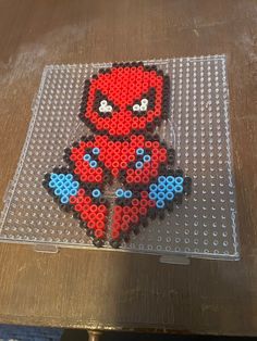 an image of a lego spider man on a table