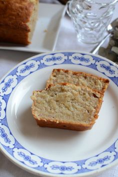 two slices of banana bread on a blue and white plate