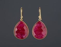 This pair of large ruby earrings would be a nice reward for yourself or a great gift for your mother or best friend. The pendant has an attractive ruby stone set in gold plated bezels:1. Stone: ruby 2. Stone shape & size: pear shape 25 x 20 mm, heart shape 20 x 20 mm3. total length: pear 42 mm, heart 36 mm4. bezel material: gold vermeil or sterling silver5. earring hook: gold vermeil or sterling silver6. an optional custom jewelry card printed with your own message, if you are sending these Handmade Earrings For Valentine's Day Formal Occasion, Elegant Handmade Earrings For Valentine's Day, Handmade Earrings For Valentine's Day Formal, Red Drop Earrings For Gift, Ruby Dangle Earrings For Party, Elegant Gemstone Teardrop Earrings For Gift, Valentine's Day Drop Earrings Gift, Ruby Drop Earrings As A Gift, Ruby Teardrop Earrings For Party