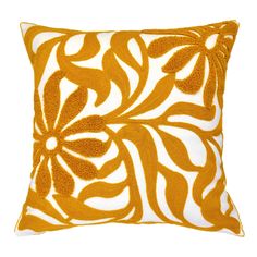 an orange and white decorative pillow on a white background