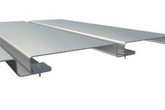 an aluminum shelf with two brackets on each side and one section missing from the wall