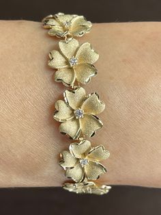 Elegant And Beautiful Hawaiian 15mm Plumeria Flower Lei With Cubic Zirconia Bracelet 7 1/4 Inches In 14K Solid Yellow Gold Sandblast Diamond Cut on the Edge of Each Petals. 14 Karat Solid Yellow Gold GUARANTEED, Authenticated with a 14K Stamp Made With Highest Quality Craftsmanship Solid 14K Yellow Gold Plumeria Flower Lei With Cubic Zirconia Bracelet Length 7.25 Inches Total Weight 17.8 grams Solid 14K Solid Yellow Gold Plumeria Flower Width 15 Millimeters Amazing Gift For Family And Friends! J Cheap Yellow Flower Bracelet, Xoxo Jewelry, Dope Jewelry Accessories, Flower Lei, Plumeria Flowers, Cubic Zirconia Bracelet, Dope Jewelry, Girly Accessories, Wedding Jewelry Bracelets