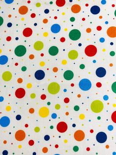 multicolored polka dots on white background