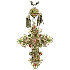 Indulge in a magnificent Museum Quality Antique Jeweled Orthodox Bishop Cross Necklace. The extraordinary necklace features a 7 inch pendant of a bejeweled cross in Silver-Gilt with a Heart motif at the top adorned with pendant tassels. The heart and cross hang from a stunning heavy 46 inch silver link chain. The chain has gold filled rondelles within the chain that match the tassels hanging from the heart. The extraordinary monumental cross hung from the neck of an Orthodox Bishop. It is jewele Antique Cross Jewelry With Large Pendant, Antique Cross Necklace For Jewelry Making, Antique Cross Necklaces For Jewelry Making, Antique Cross Necklace With Large Pendant, Traditional Cross Pendant Large Jewelry, Traditional Cross Pendant Necklace With Large Pendant, Traditional Cross Necklace With Large Pendant, Traditional Necklace With Large Cross Pendant, Spiritual Silver Jeweled Necklaces