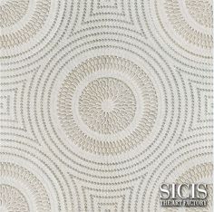 a white wallpaper with circular designs on it