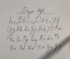 handwriting written in cursive writing on white paper