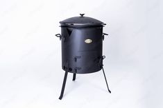 the black stove is sitting on top of a stand