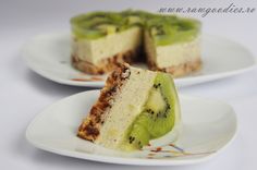 two slices of cheesecake with kiwi on them