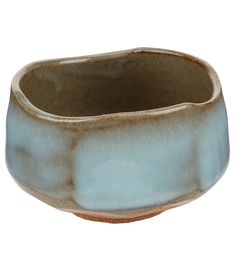 a brown and blue ceramic bowl on a white background