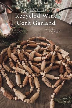 a bunch of wine corks sitting on top of a table next to a christmas tree