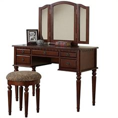 a wooden vanity with mirror and stool