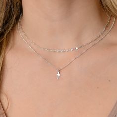 This layered silver cross necklace is a set of 2. The chains are solid sterling silver 925. They have an extension so that the size can be adjusted. The one necklace is a plain chain while the other has a small cross on it. Cross Necklace Layering, Silver Necklace Stack Dainty, Silver Necklace With Delicate Chain And Cross Pendant, Silver Cross Necklace With Delicate Chain, Silver Charm Necklace With Cross Pendant And Delicate Chain, Silver Charm Necklace With Cross Pendant, Sterling Silver Cross Charm Necklace With Adjustable Chain, Silver Sterling Cross Necklace With Delicate Chain, Sterling Silver Cross Necklace With Delicate Chain