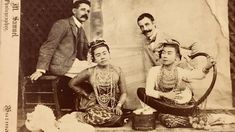 an old photo of three people sitting next to each other