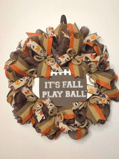 a football wreath that says it's fall play ball