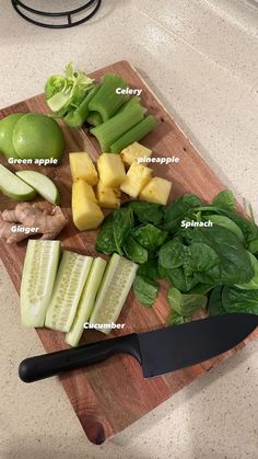 a cutting board topped with lots of different types of vegetables