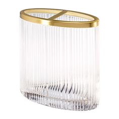 a clear glass vase with gold trimmings on the top and bottom, in front of a white background