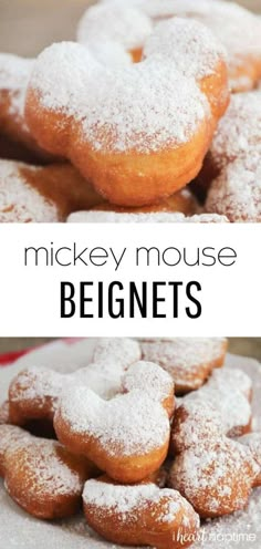 mickey mouse doughnuts are piled on top of each other with powdered sugar