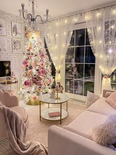 a living room with a christmas tree in the corner and lights hanging from the ceiling