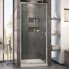 a bathroom with a walk in shower next to a bathtub and shelves on the wall