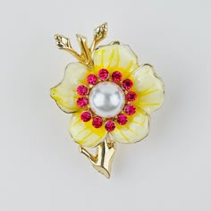 Adorn yourself with the vibrant beauty of our Yellow Flower Brooch Pin, a delightful accessory that captures the essence of sunny days and blooming gardens. Crafted with meticulous attention to detail, this brooch features a radiant yellow enamel flower with a captivating center embellished with shimmering pink crystals. The cheerful yellow hue of the flower symbolizes joy, positivity, and optimism, making this brooch the perfect accessory to brighten up any outfit and uplift your spirits. Wheth Vegetable Jewelry, Baroque Jewelry, Insect Jewelry, Summer Soiree, Pearl Brooch, Enamel Flower, Yellow Flower, Sparkling Crystal, Summer Jewelry