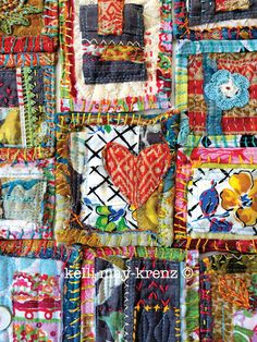 a colorful quilt with many different designs on it