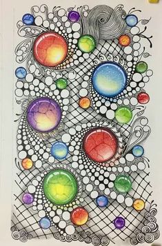 a drawing with different colored circles and bubbles on it's surface, in the middle of