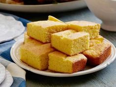 several pieces of cornbread on a white plate