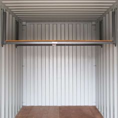 an empty storage container is shown with no people in it and the doors are open