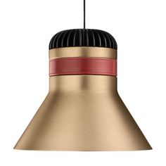 a gold and red pendant light hanging from a ceiling fixture with a black cord attached to it