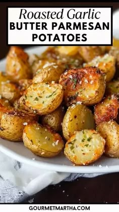 roasted garlic butter parmesan potatoes on a white plate