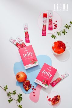 the contents of jelly are laid out next to each other on a white surface with green leaves