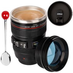 a camera lens with a spoon next to it