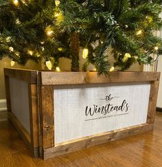 a christmas tree is in a wooden box with the words, the winelands on it