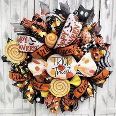 a halloween wreath with candy and candies on it