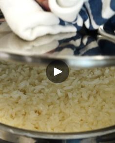 a bowl filled with rice on top of a table