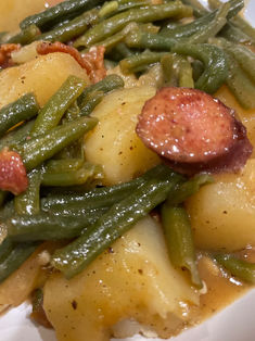 green beans recipe Easy Smothered Green Beans, Smoked Sausage Green Beans Potatoes, Green Bean Potatoes And Sausage Crockpot, Portuguese Green Beans And Linguica, Smothered Green Beans With Sausage, How To Cook Andouille Sausage, Potato Green Beans And Sausage, Green Bean Potato Recipes, Potatoes Green Beans Sausage