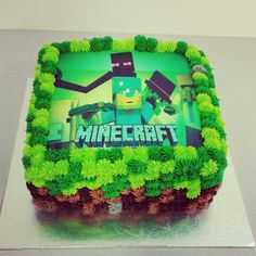 a cake with green frosting and an image of a minecraft character on it