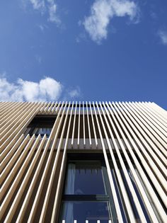 the side of a tall building with many windows