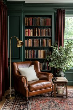 a leather chair sitting in front of a book shelf filled with books and a lamp