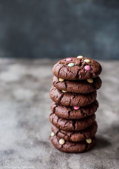 a stack of chocolate cookies with sprinkles