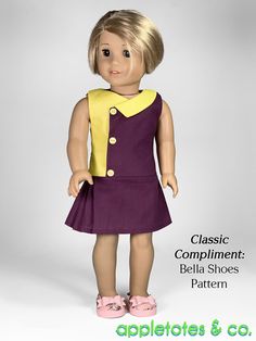 the doll is wearing a purple dress and yellow vest