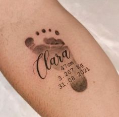 a close up of a person's arm with a tattoo on it that says clara