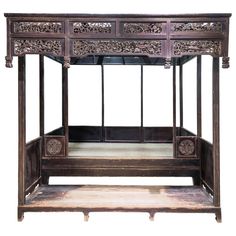 An antique canopy bed from Shanxi province made of Elm wood. This bed has all the attention focused on the front carvings while keeping a very simple and clean overall look. There is an extended area in front of the bed (around 67cm wide x H20cm) which acts as a foot rest, and is also a place where a washbasin stand would have been placed. On the carving, you can see a wide variety of mostly auspicious flowers and animals, for example the phoenix, kirin, fish, peony, lotus & cherry blossom, Antique Canopy Bed, Enclosed Bed, French Empire Furniture, Flowers And Animals, Canopy Bed Diy, Bed Nook, Wedding Bed, Modern Bed Set, Canopy Bed Frame