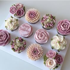 there are many cupcakes with flowers on them