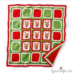 a crocheted blanket with teddy bears on it and red, green and white squares