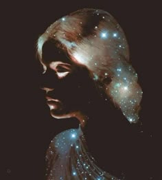 an image of a woman's face with stars in the sky above her head