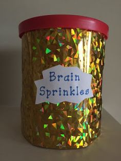 a canister with a label on it that says brain sprinkles inside