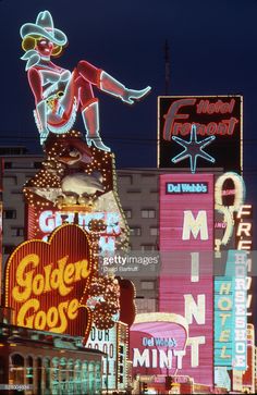 the neon signs are all lit up for western themed nights in las vegas, nv