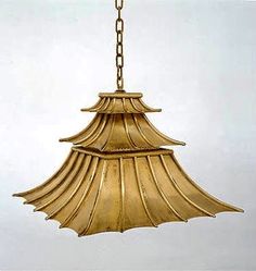 a gold colored chandelier hanging from a chain